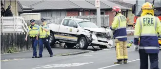  ?? PHOTO: LINDA ROBERTSON ?? Serious crash . . . This damaged utility came to rest near the southbound lane of King Edward St, South Dunedin, after a crash.