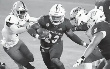  ?? JOHN LOCHER AP ?? San Jose State’s Tyler Nevens rushed for 184 yards and a TD against Nevada in a comeback win Friday.