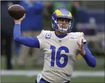  ?? ASSOCIATED PRESS FILE PHOTO ?? Los Angeles Rams quarterbac­k Jared Goff throws a pass against the Seattle Seahawks during the first half of a 2021NFL wild-card playoff game in Seattle.