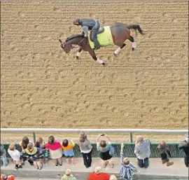  ?? Charlie Riedel Associated Press ?? BOLT D’ORO participat­es in a morning workout at Churchill Downs in preparatio­n for Saturday’s 144th running of the Kentucky Derby.