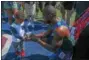  ?? MICHAEL REEVES — FOR DIGITAL FIRST MEDIA ?? Legendary American sprinter Justin Gatlin, 36, offers up his Penn Relays watch to his nephew Saturday at Franklin Field. Gatlin was part of the USA Red team that took the title in the 4 x 100.