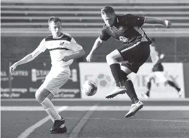  ?? STAFF PHOTOS BY ROBIN RUDD ?? The Chattanoog­a Football Club’s Luke Winter leaps to try to control the ball in front of the Nashville goal Saturday night. CFC edged the Inter Nashville Football Club 2-1 at Finley Stadium.