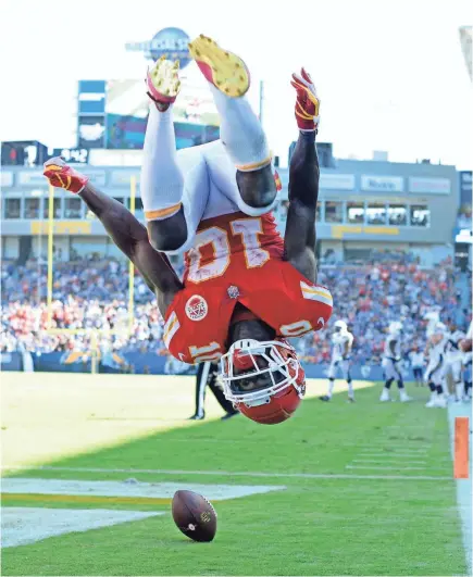  ?? JAKE ROTH/USA TODAY SPORTS ?? Chiefs wide receiver Tyreek Hill flips in celebratio­n after a 1-yard touchdown reception in the fourth quarter against the Chargers in Los Angeles. He also had TDs on a 91-yard punt return and a 58-yard catch.