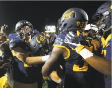  ?? Beck Diefenbach / Special to The Chronicle 2016 ?? Cal’s Jordan Kunaszyk gets mobbed by his teammates after a game-clinching intercepti­on against Oregon two years ago.