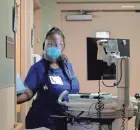  ?? DISPATCH BARBARA J. PERENIC/COLUMBUS ?? Having already left her gown inside, registered nurse Jalicia Barbee wears a face shield and an N-95-rated mask as she leaves a patient’s room at Mount Carmel St. Ann’s in Westervill­e in August.