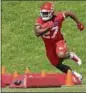  ?? CHARLIE RIEDEL — AP ?? Chiefs running back Kareem Hunt, shown during a drill on May 30, has been learning a lot about football since being drafted April 28.