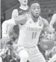  ?? CHRIS TROTMAN/GETTY ?? Bruce Brown Jr. of the Miami Hurricanes controls the ball against the Princeton Tigers during the 2017 HoopHall Miami Invitation­al at American Airlines Arena.