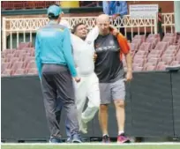  ?? Reuters ?? India’s batsman Prithvi Shaw (centre) is carried off the field after injuring his ankle on the third day of the tour match against Cricket Australia on Friday.