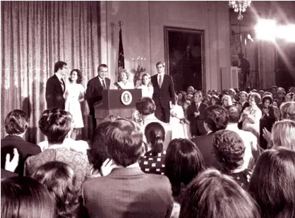  ?? Agence France-presse ?? American President Richard Nixon, along with members of his family, addresses the White House employees on August 9, 1974, in Washington, after his resignatio­n from the presidency after the Watergate scandal.