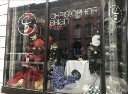  ?? PHOTO PROVIDED ?? Christophe­r Brian Salon earned the People’s Choice award in the 2018Troy Victorian Stroll Window Decorating Contest.