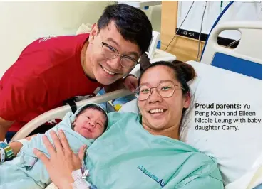  ??  ?? Proud parents: Yu Peng Kean and Eileen Nicole Leung with baby daughter Camy.