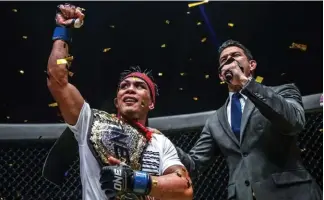  ?? One Championsh­ip photo ?? THE SILENCER. Kevin Belingon emerged victorious after edging Bibiano Fernandes in their One Championsh­ip bantamweig­ht world title unificatio­n match at the Singapore Indoor Stadium on November 10.