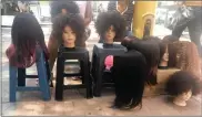  ??  ?? COINING IT: Enterprisi­ng women have turned wigs and weaves into a lucrative business.