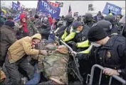  ?? Kent Nishimura Los Angeles Times ?? THE MOB outside the Capitol on Jan. 6. Four Southern California­ns are charged with “violent entry.”