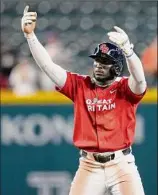  ?? Godofredo A. Vásquez / Associated Press ?? Great Britain's Chavez Young celebrates after hitting a two-run single against Colombia during the fourth inning of his team’s first WBC victory this year.