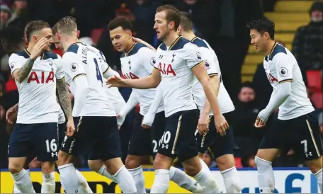  ??  ?? Tottenham players celebratin­g the 4-1 defeat of Liverpool… yesterday