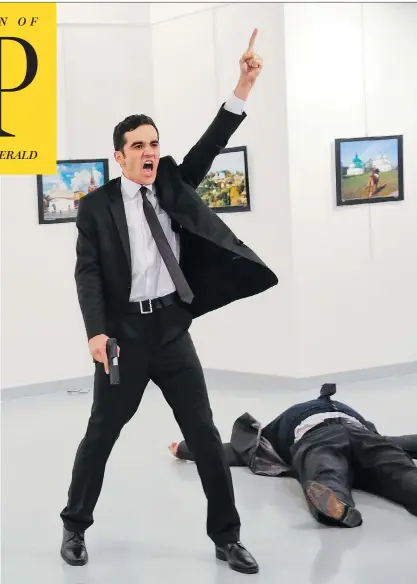  ?? BURHAN OZBILICI / THE ASSOCIATED PRESS ?? Mevlut Mert Altintas, 22, a riot squad police officer who was not scheduled to be on duty at an Ankara art gallery Monday night, opened fire during the launch of an exhibition of photograph­y about Russia, fatally shooting Andrey Karlov, the Russian...