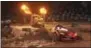  ?? DISNEY-PIXAR VIA AP ?? This image released by Disney shows Lightning McQueen, voiced by Owen Wilson, In “Cars 3,” foreground, in a scene from “Cars 3.”