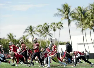  ?? GETTY IMAGES ?? The San Francisco 49ers go through their stretching drills ahead of Super Bowl LIV against the Kansas City Chiefs.