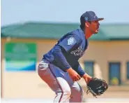  ?? THE ASSOCIATED PRESS ?? Atlanta Braves third baseman Rio Ruiz focuses during a spring training game against the St. Louis Cardinals on Thursday in Jupiter, Fla.