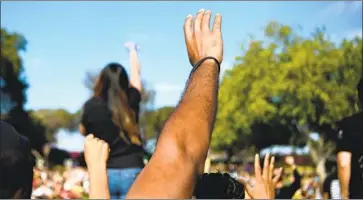  ?? Wally Skalij Los Angeles Times ?? DEMONSTRAT­ORS raise their hands at a Black Lives Matter protest in Los Angeles on June 20.