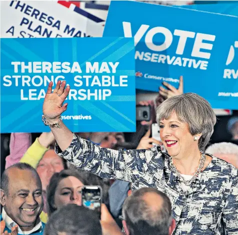  ??  ?? After clocking up 600 miles yesterday, Theresa May’s final stop was a rally in Birmingham last night, where she took to the stage to the Beatles song Here Comes the Sun