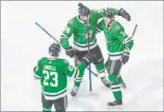  ?? Jason Franson The Associated Press ?? Stars Esa Lindell (23), Denis Gurianov and John Klingberg rejoice after a third-period goal. Dallas leads Calgary 3-2 in their series.