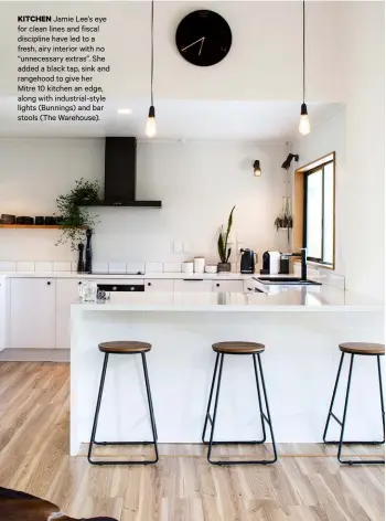  ??  ?? KITCHEN Jamie Lee’s eye for clean lines and fiscal discipline have led to a fresh, airy interior with no “unnecessar­y extras”. She added a black tap, sink and rangehood to give her Mitre 10 kitchen an edge, along with industrial-style lights (Bunnings) and bar stools (The Warehouse).