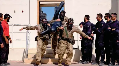  ??  ?? some of the elite commandos compete in a hostage rescue mission as part of the competitio­n.