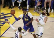  ?? KARL MONDON — BAY AREA NEWS GROUP ?? The Golden State Warriors’ Kevon Looney (5) scoops up one of his 22rebounds against the Memphis Grizzlies in Game 6 of a second-round playoff series at Chase Center in San Francisco on Friday.
