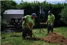  ?? Desiree Rios/The Guardian ?? Michael McCallen and Isidro Arellanos dig up a cesspool cover after receiving an emergency call from a resident experienci­ng sewage backup in Sag Harbor. Photograph: