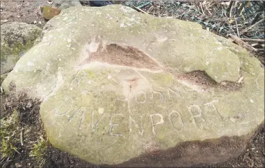  ?? Arnold Gold / Hearst Connecticu­t Media ?? A boundary stone marking a border of the Rev. John Davenport’s farm lies near the bank of the Quinnipiac River in New Haven.