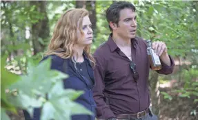  ?? HBO ?? Camille (Amy Adams) and Richard (Chris Messina) investigat­e a killer.