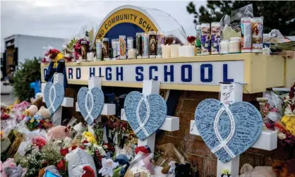  ?? ?? A growing memorial is pictured outside Oxford high school, days after the shooting took place. Photograph: Nic Antaya/EPA
