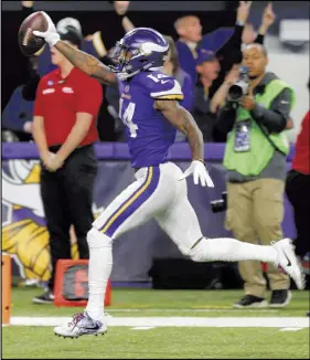  ?? AP Photo ?? Minnesota Vikings wide receiver Stefon Diggs (14) runs in for a game winning touchdown against the New Orleans Saints during the second half of an NFL divisional football playoff game in Minneapoli­s, Sunday. The Vikings defeated the Saints 29-24.