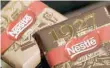  ?? — Reuters ?? Chocolate packets are displayed in the showroom at the headquarte­rs of Nestle in Vevey, Switzerlan­d.