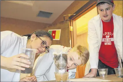  ?? LYNN CURWIN/TRURO DAILY NEWS ?? Pugwash District High School students, from left, Megumi Ozawa, Lucas Bolling and Noah Pollard enjoyed taking part in the water purificati­on project during a Maker Tech event. Each group had to work on a way to make dirty water cleaner.