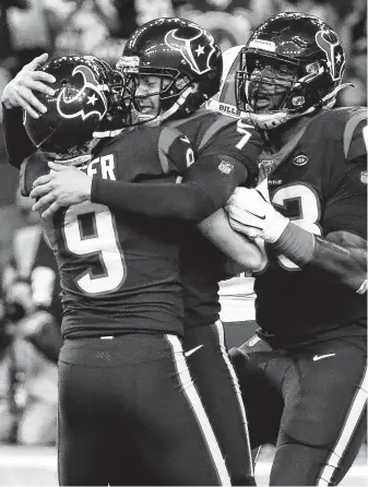  ?? Karen Warren / Staff photograph­er ?? Texans kicker Ka’imi Fairbairn (7) hugs holder Bryan Anger (9) after booting the game-winning field goal in overtime Saturday.