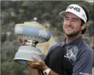  ?? ERIC GAY — THE ASSOCIATED PRESS ?? Bubba Watson holds his trophy after winning the during the final round at the Dell Technologi­es Match Play golf tournament, Sunday in Austin, Texas. Watson defeated Kevin Kisner.