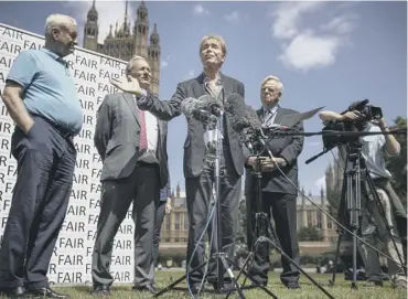  ??  ?? 0 Sir Cliff Richard with broadcaste­r Paul Gambaccini, far left, outside the Houses of Parliament