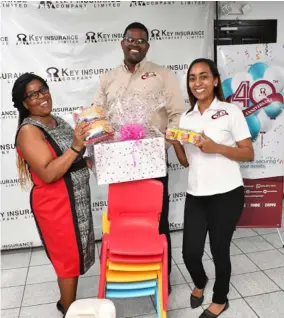  ?? ?? As part of its 40th anniversar­y celebratio­ns, Key Insurance’s Cross Roads branch donated food items and school chairs to St Stephen’s United Church Early Childhood Developmen­t Centre.