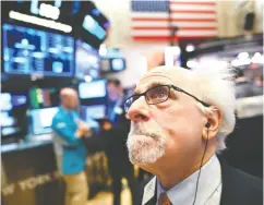 ?? JOHANNES eisele / AFP VIA GETTY IMAGES FILES ?? A traderat the New York Stock Exchange. Bad markets are a necessary part of investing so you might as well get good at them, Tom Bradley writes.