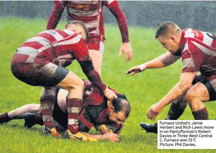  ??  ?? Furnace United’s Jamie Herbert and Rich Lewis move in on Pantyffynn­on’s Robert Davies in Three West Central C. Furnace won 13-7. Picture: Phil Davies.