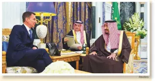  ?? Reuters ?? Saudi Arabia’s King Salman Bin Abdul Aziz Al Saud with British Foreign Secretary Jeremy Hunt in Riyadh yesterday.