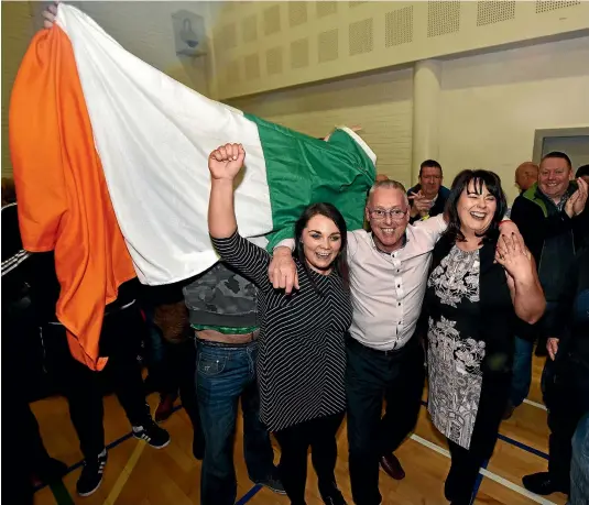  ?? GETTY IMAGES ?? Sinn Fein candidates, from left, Jemma Dolan, Sean Lynch and Michelle Gildernew celebrate winning their seats in Fermanagh South Tyrone, after Northern Ireland’s voters went to the polls for a second time in 10 months following the collapse of the...