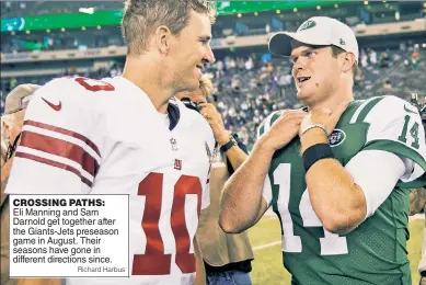  ?? Richard Harbus ?? CROSSING PATHS: Eli Manning and Sam Darnold get together after the Giants-Jets preseason game in August. Their seasons have gone in different directions since.