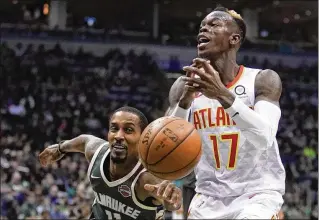  ?? MORRY GASH /AP ?? The Bucks’ Brandon Jennings knocks the ball from Dennis Schroder during the second half of Saturday night’s game in Milwaukee. Schroder fouled out late and also incurred a costly technical foul for exchanging words with an official. The Bucks won...