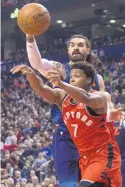  ?? CHRIS YOUNG/ASSOCIATED PRESS ?? Toronto’s Kyle Lowry (7) passes the ball under pressure from Oklahoma City’s Steven Adams on Sunday.