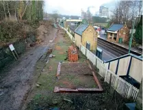  ?? GARETH EVANS ?? This view of the old Glyn Valley Tramway station at Chirk taken from the road bridge on December 28, shows the results of clearance work undertaken in recent times, revealing the outline of the old GVT station building. The GVT line to Glyn Ceiriog, part of which Glyn Valley Tramway Trust aims to revive, passed under its own arch to continue behind the photograph­er.