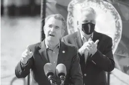  ?? STEVE HELBER/AP ?? Gov. Ralph Northam, left, speaks during a news conference along with Democratic gubernator­ial candidate Terry McAuliffe on Thursday at Waterside in Norfolk.